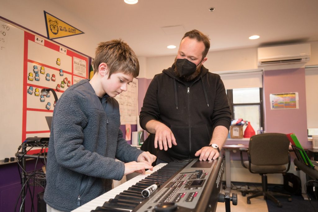 Students playing keyboard