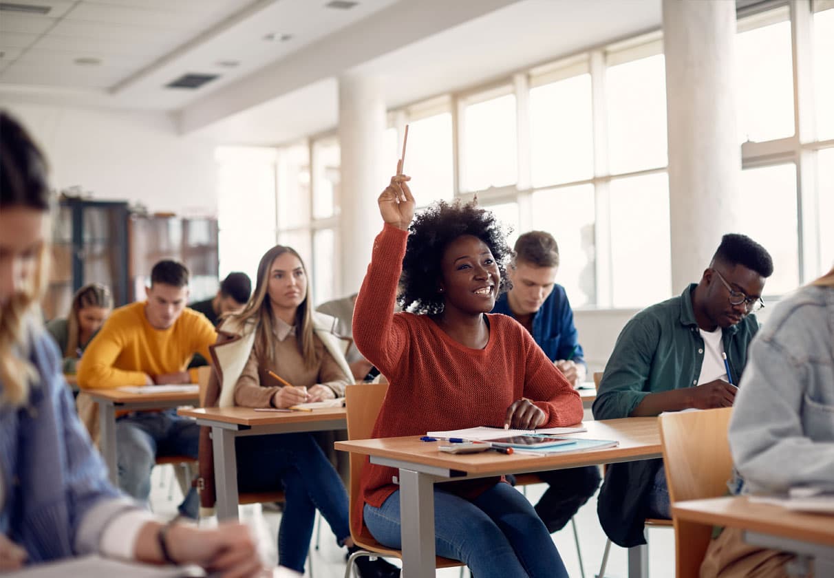 Student in class raiding her hand