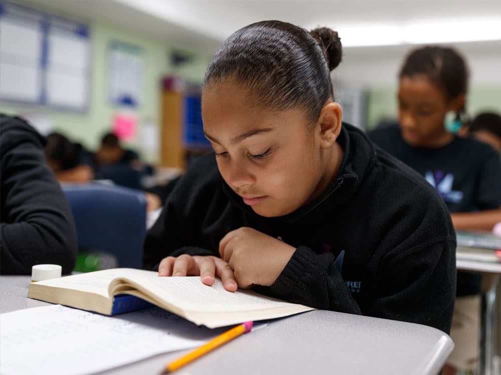 Student at her desk reading