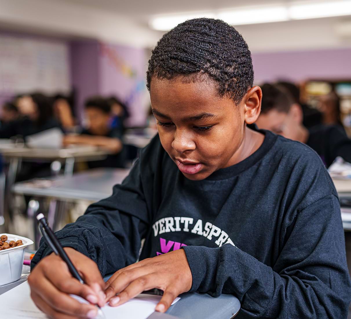 young student taking notes