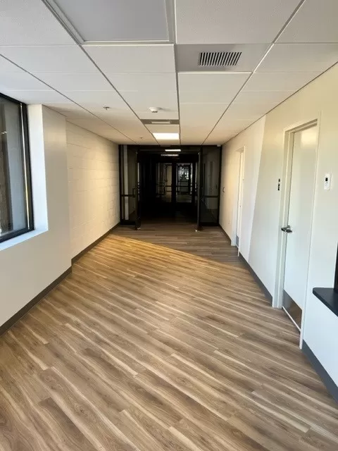 School hallway with wooden flooring
